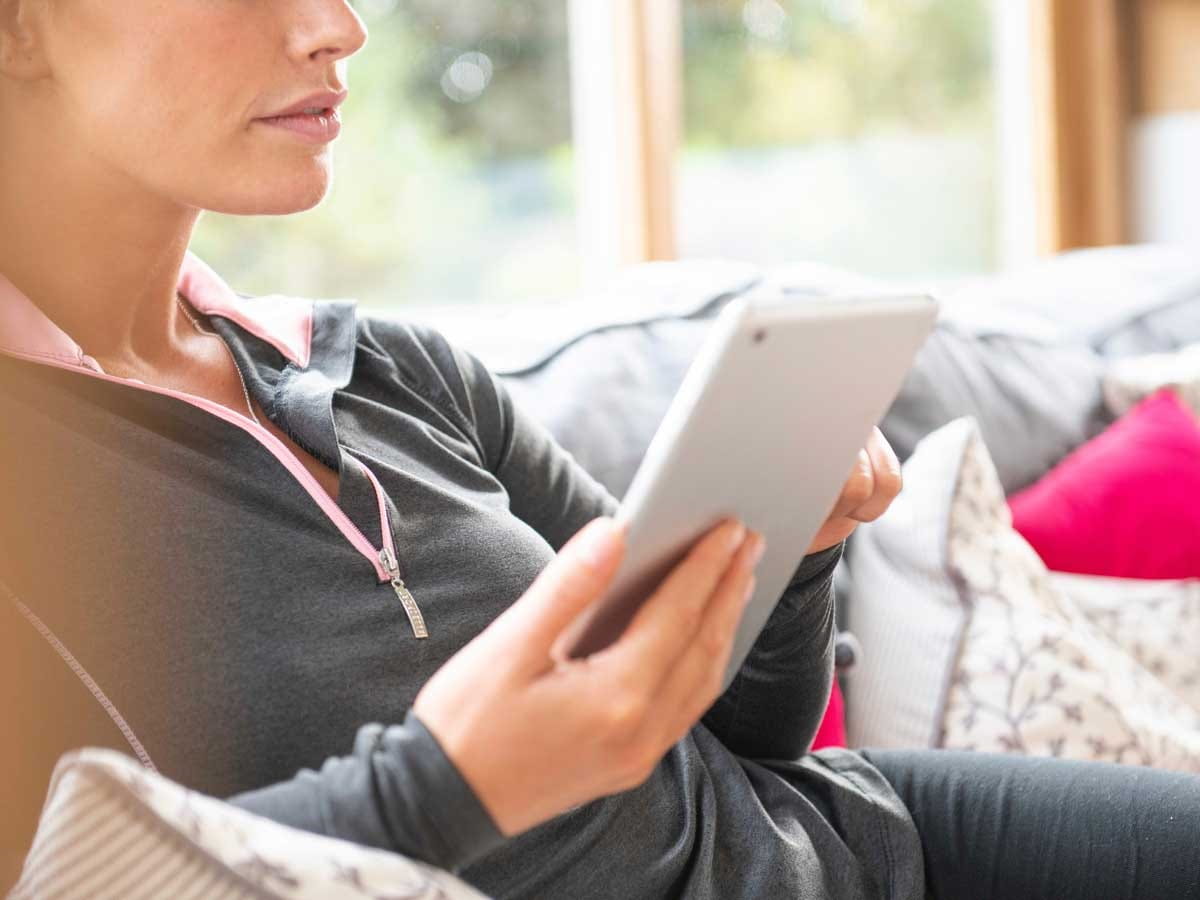 Decorative image of a woman in her iPad