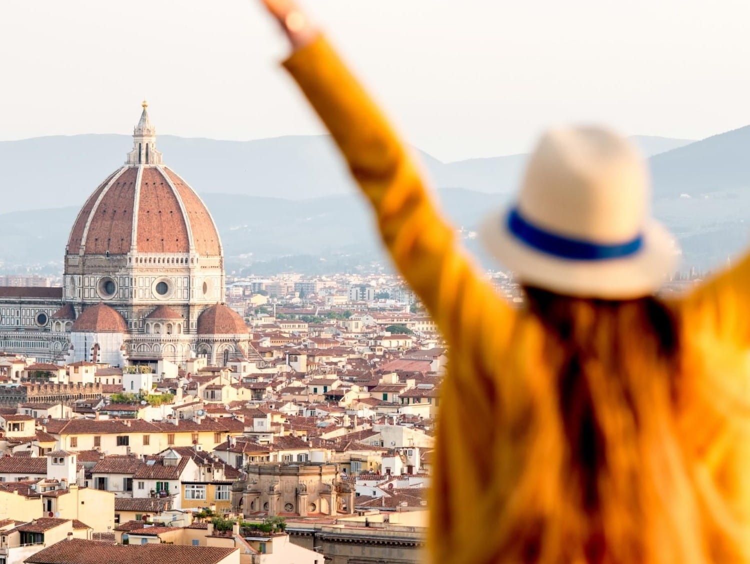 Woman waving arms in the air