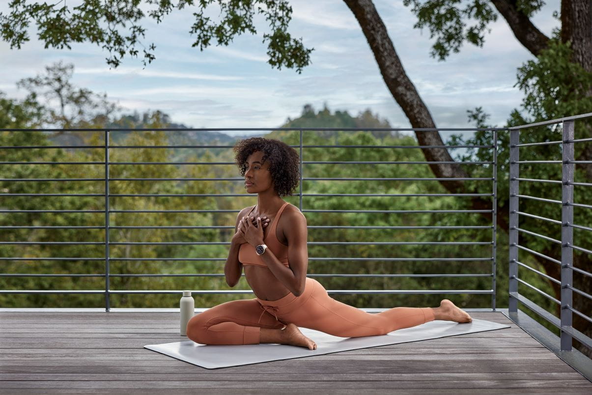 Person doing yoga, with Garmin