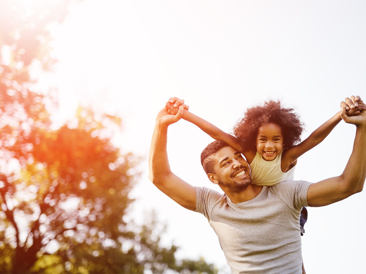 father and daughter smiling