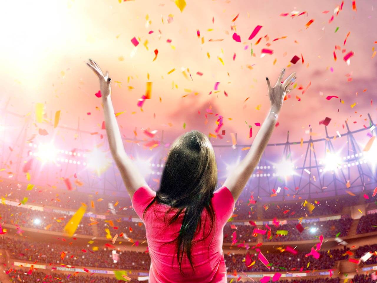 woman celebrating in sports stadium