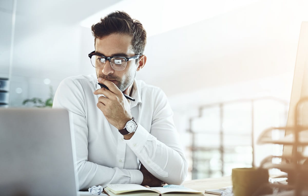 Young working men siting in the office with laptop