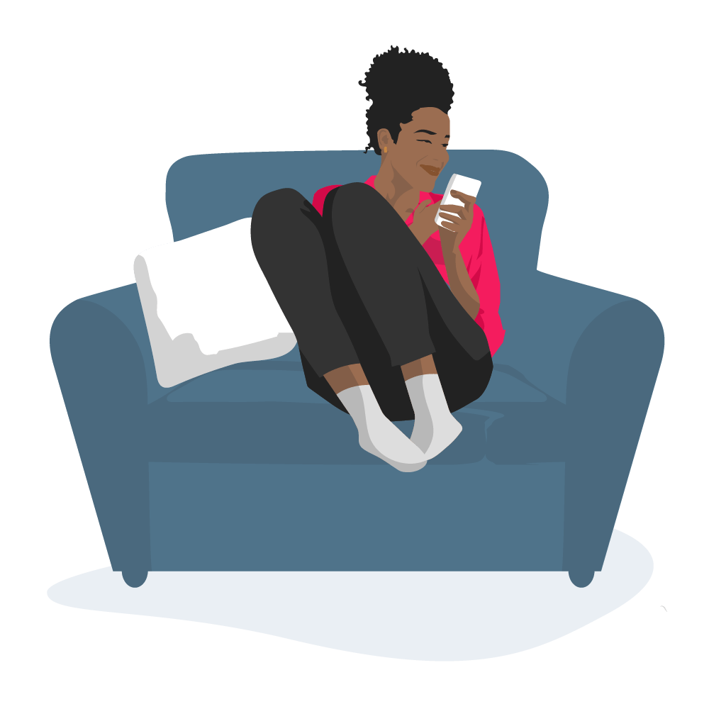 Woman sitting on sofa using smartphone