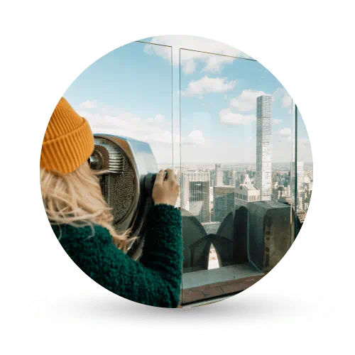 Woman using telescope in New York