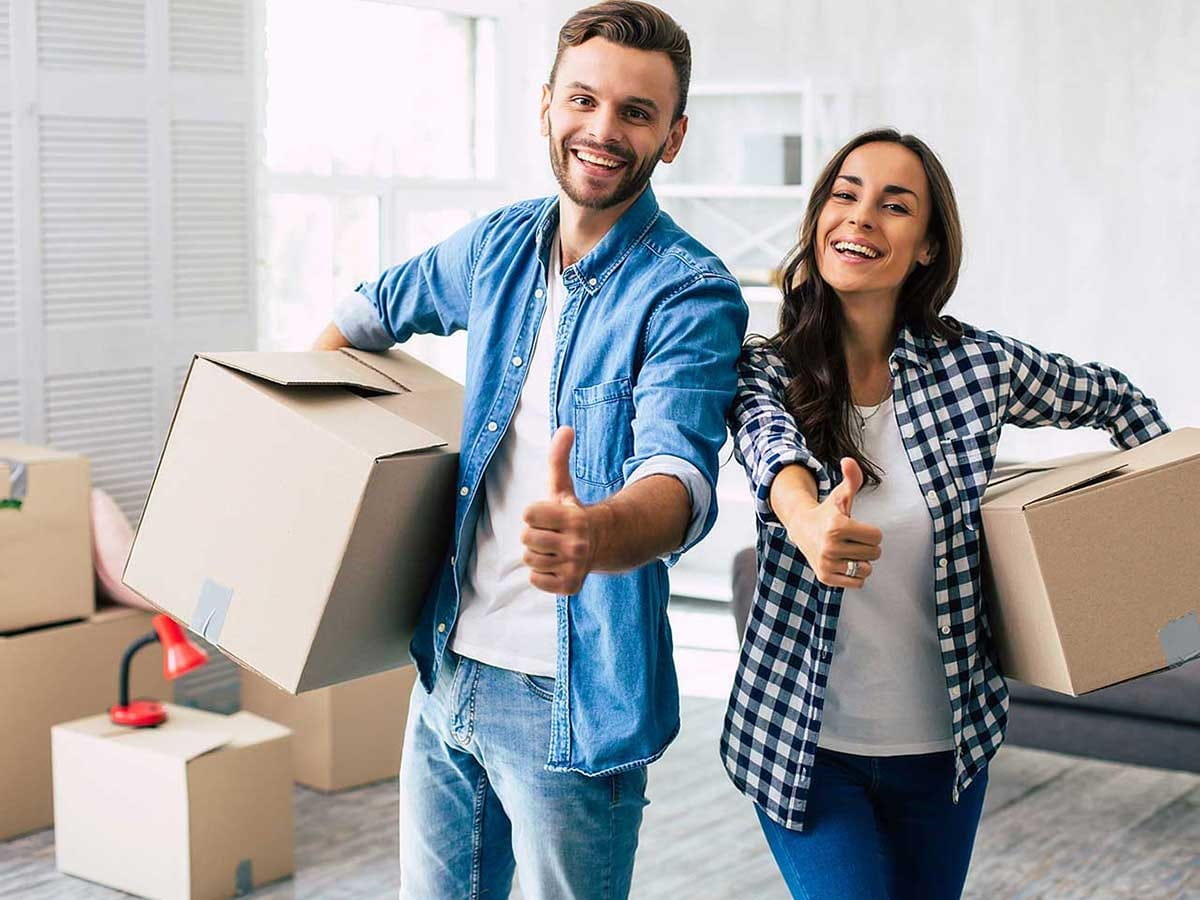 A couple unpacking boxes in their new home 