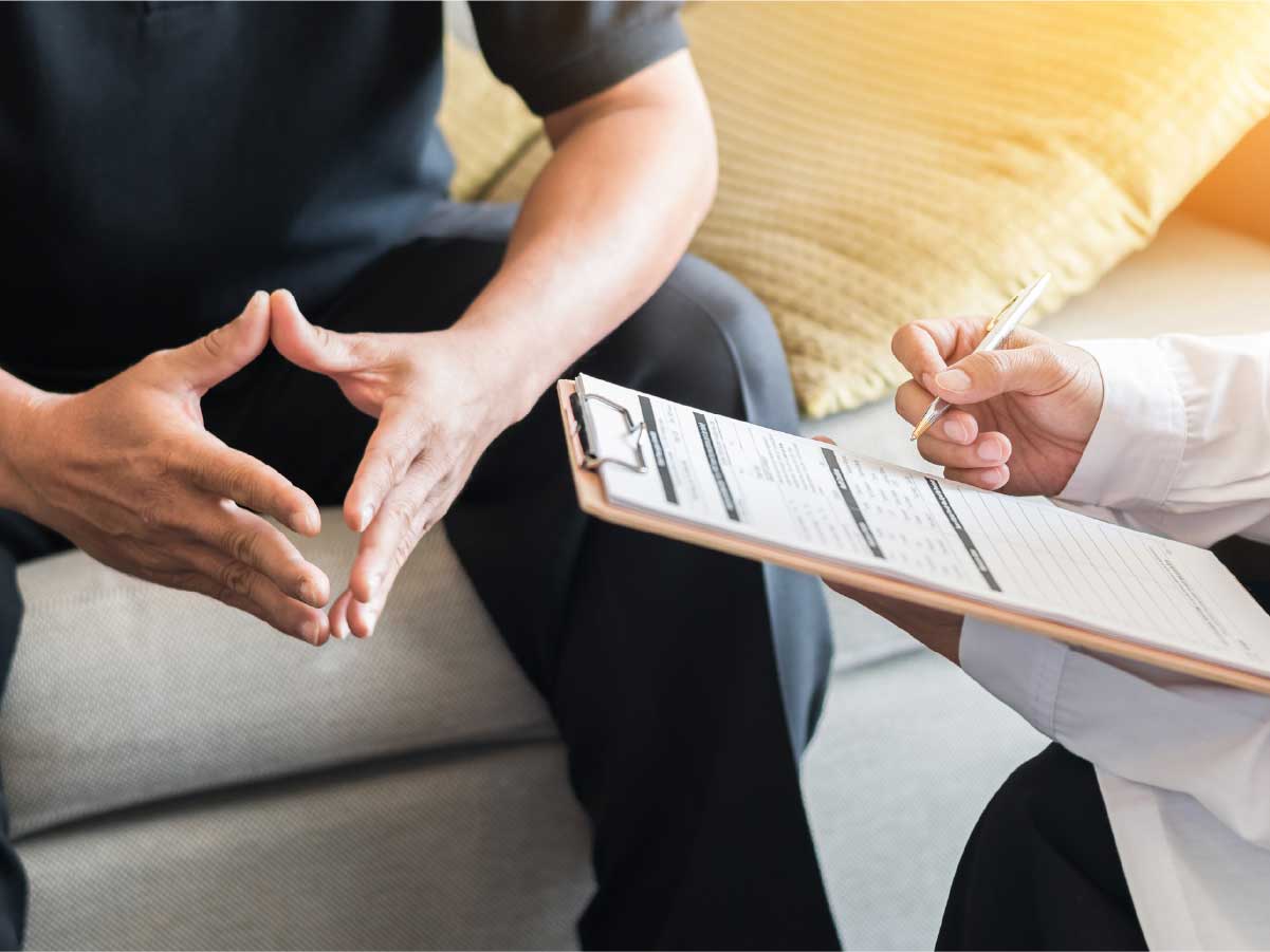 A doctor with a checklist with someone paying attention