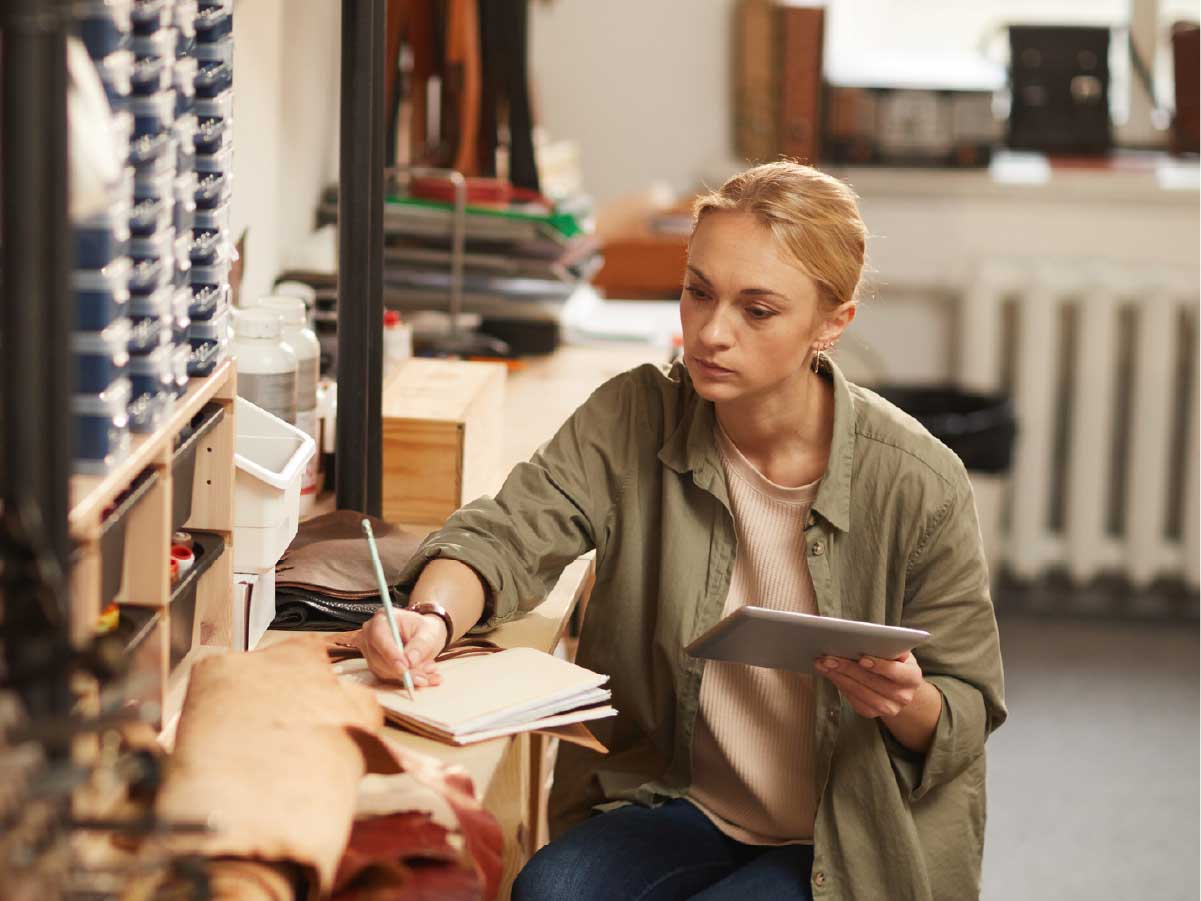 A woman planning her finances with her tablet