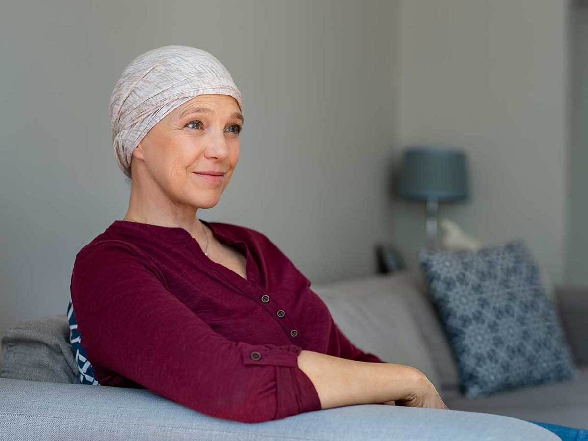 Woman sitting on the sofa in her living room