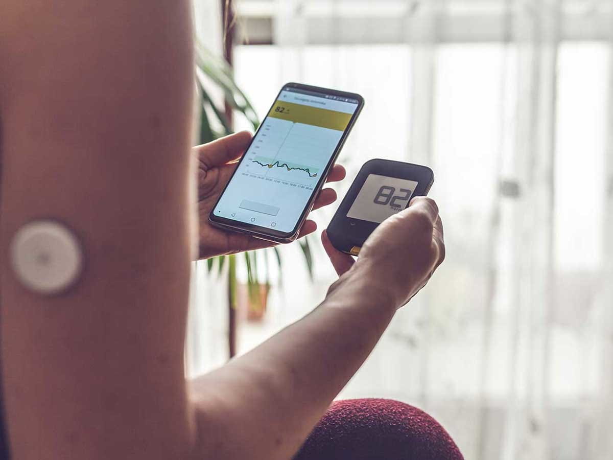 A person checking their diabetes on their phone