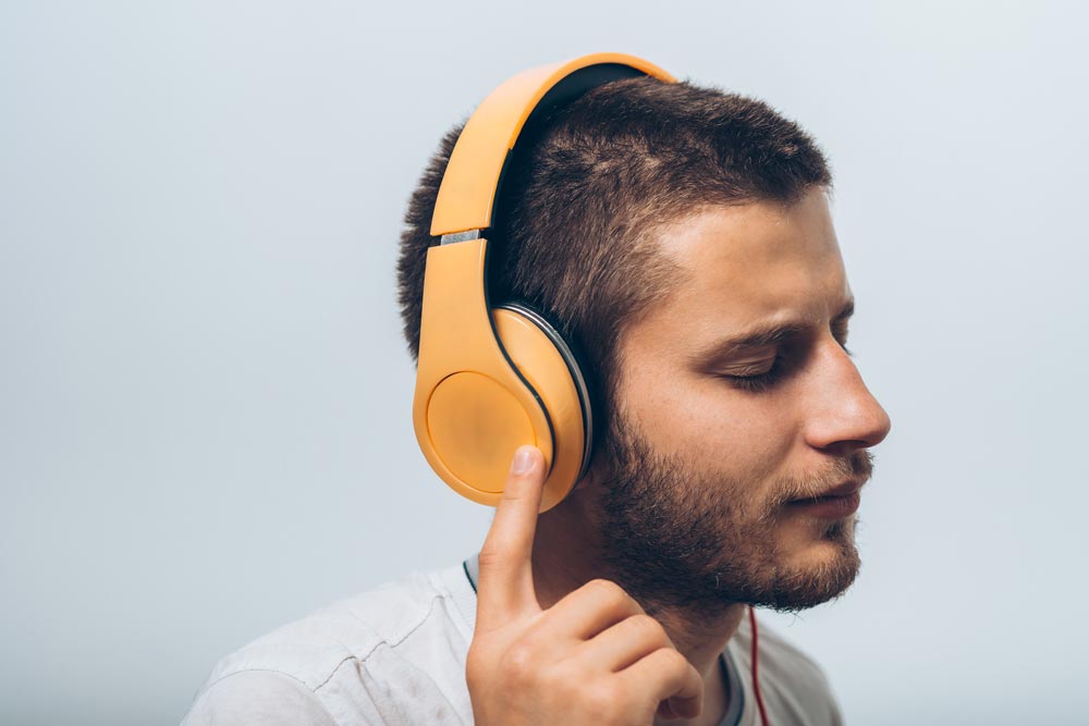 Bearded man wearing headphones