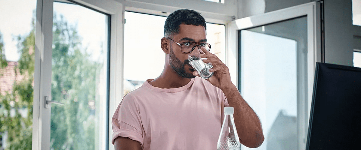 Man drinking glass of water