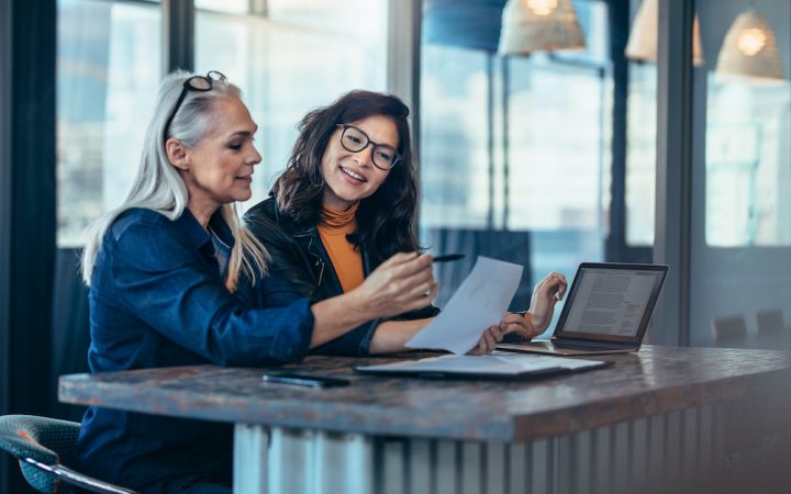 Woman at work giving support to colleague during menopause
