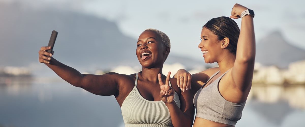 Women exercising together selfie