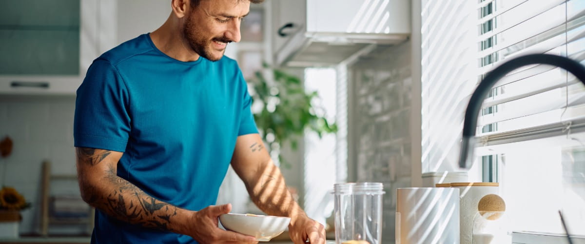 man-making-bowl-of-wholegrain-cereal