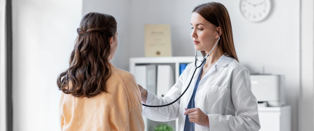 doctor-using-a-stethoscope-on-a-patient