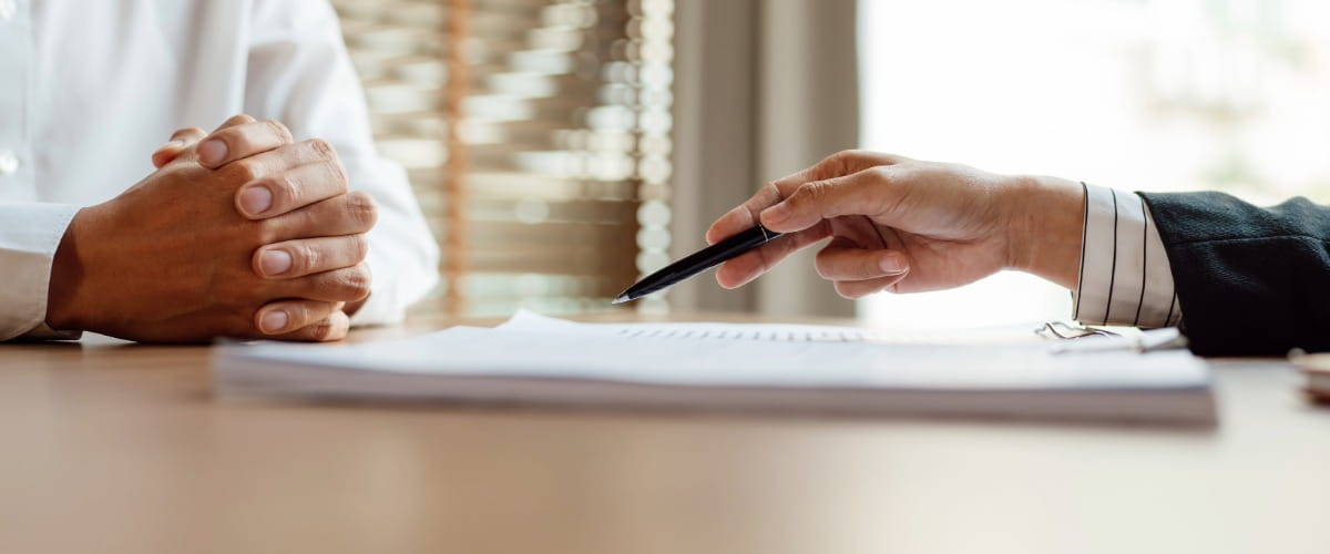 two-people-discussing-paperwork