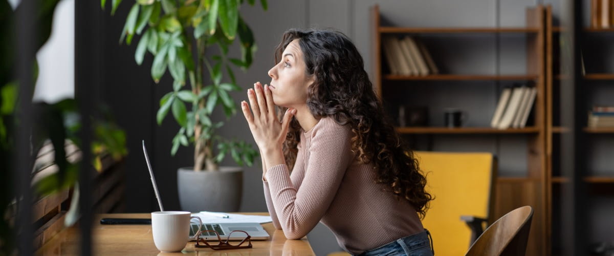 woman-working-from-home-looking-out-the-window
