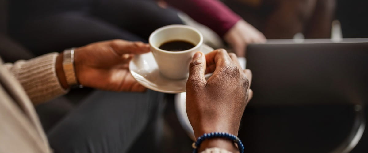 worker-holding-a-cup-of-coffee