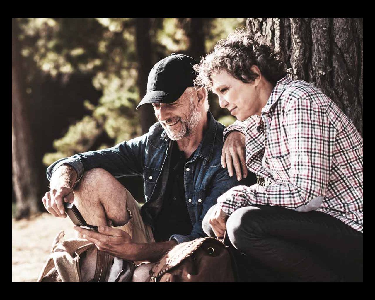 Later Life Options couple by walking forest
