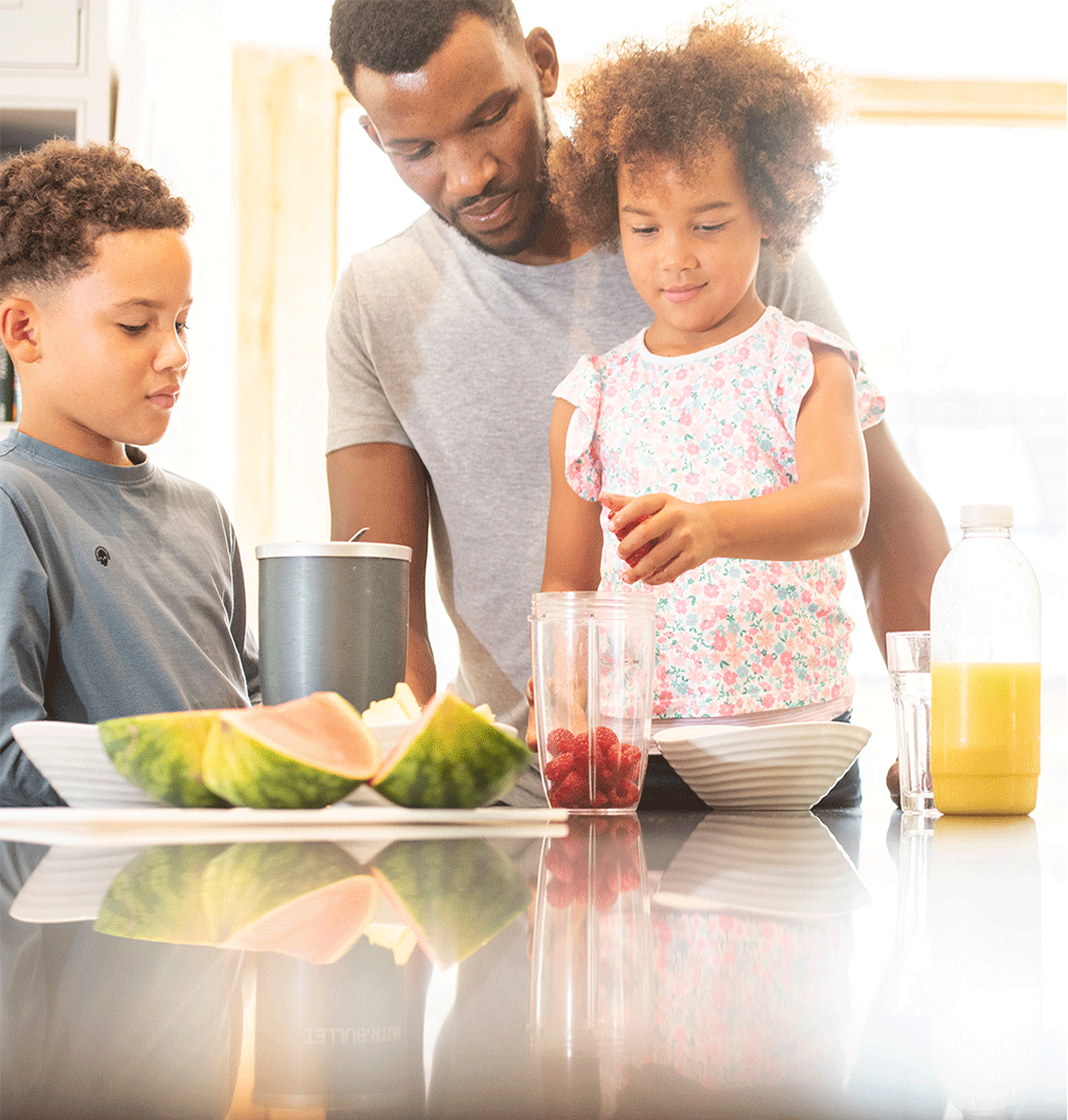 Family making fruit smoothie