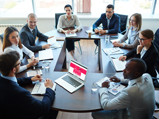 Business people sitting around a table