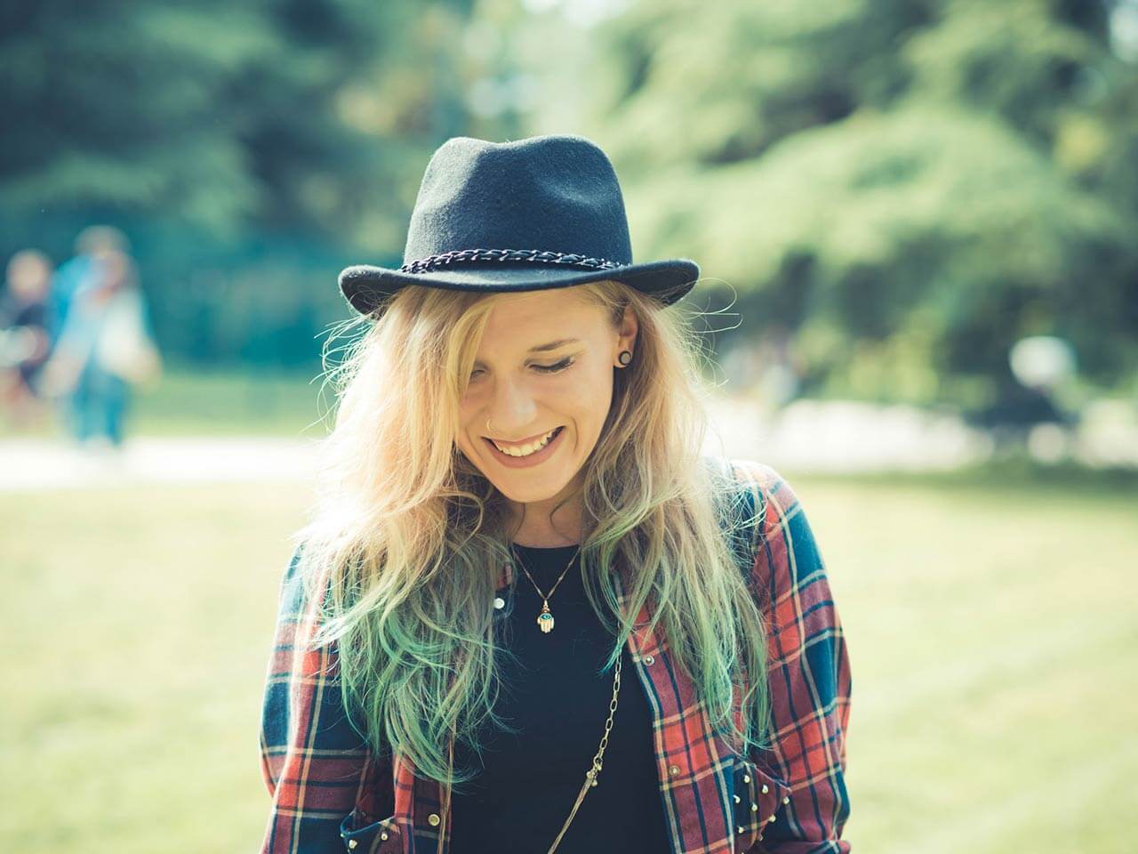 lady smiling in a park
